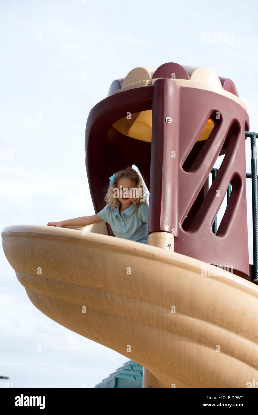 https://c8.alamy.com/comp/EJDPWT/four-year-old-girl-going-down-slide-on-park-playground-EJDPWT.jpg