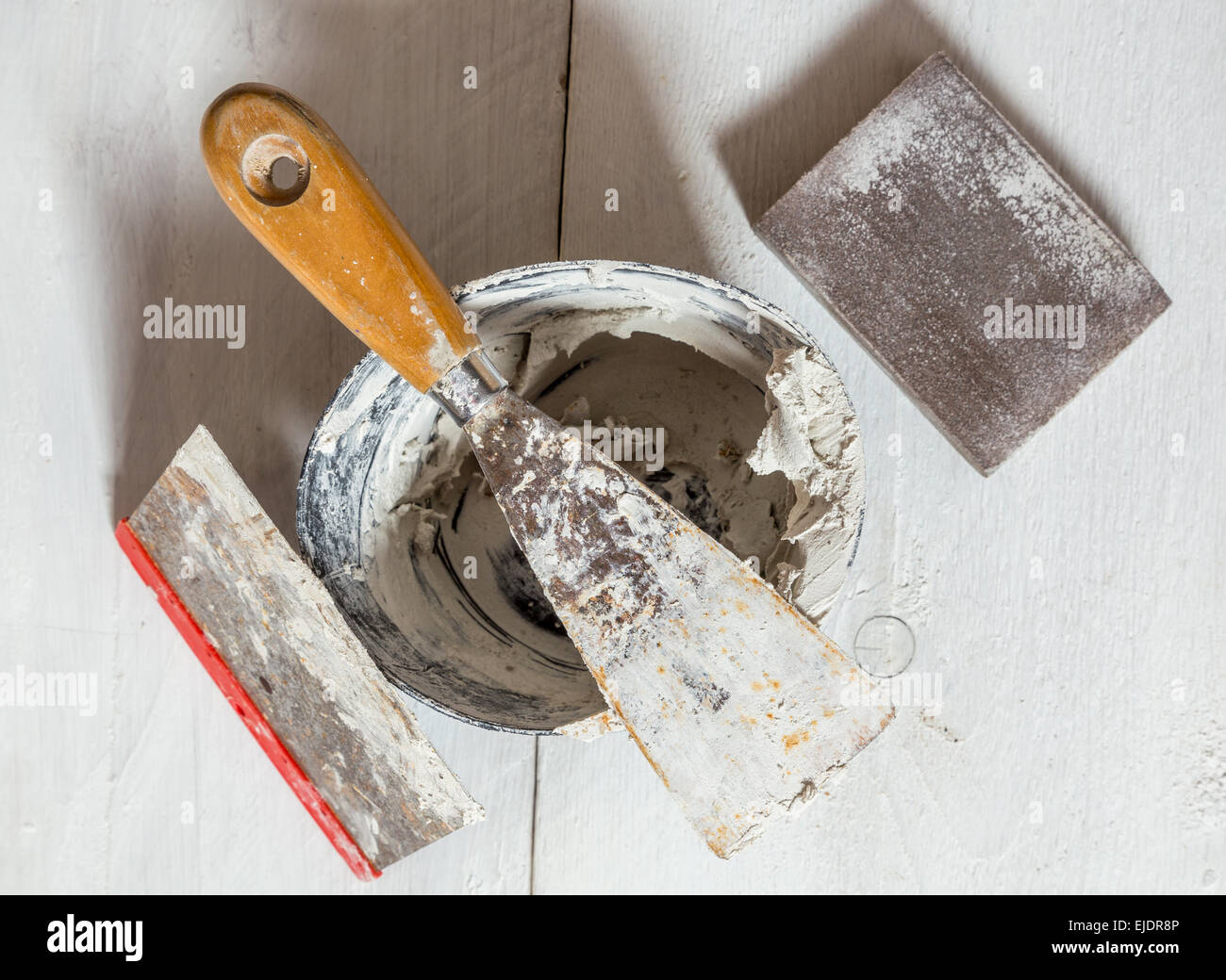 Spatula mixing tub and sanding block. Stock Photo