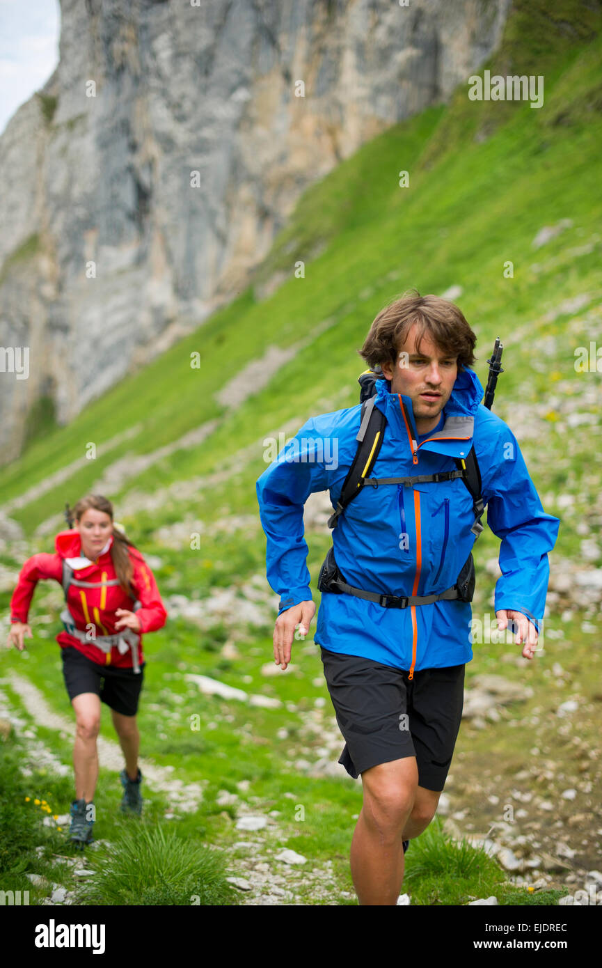 Man and woman hiking, Appenzellerland, Switzerland. Stock Photo