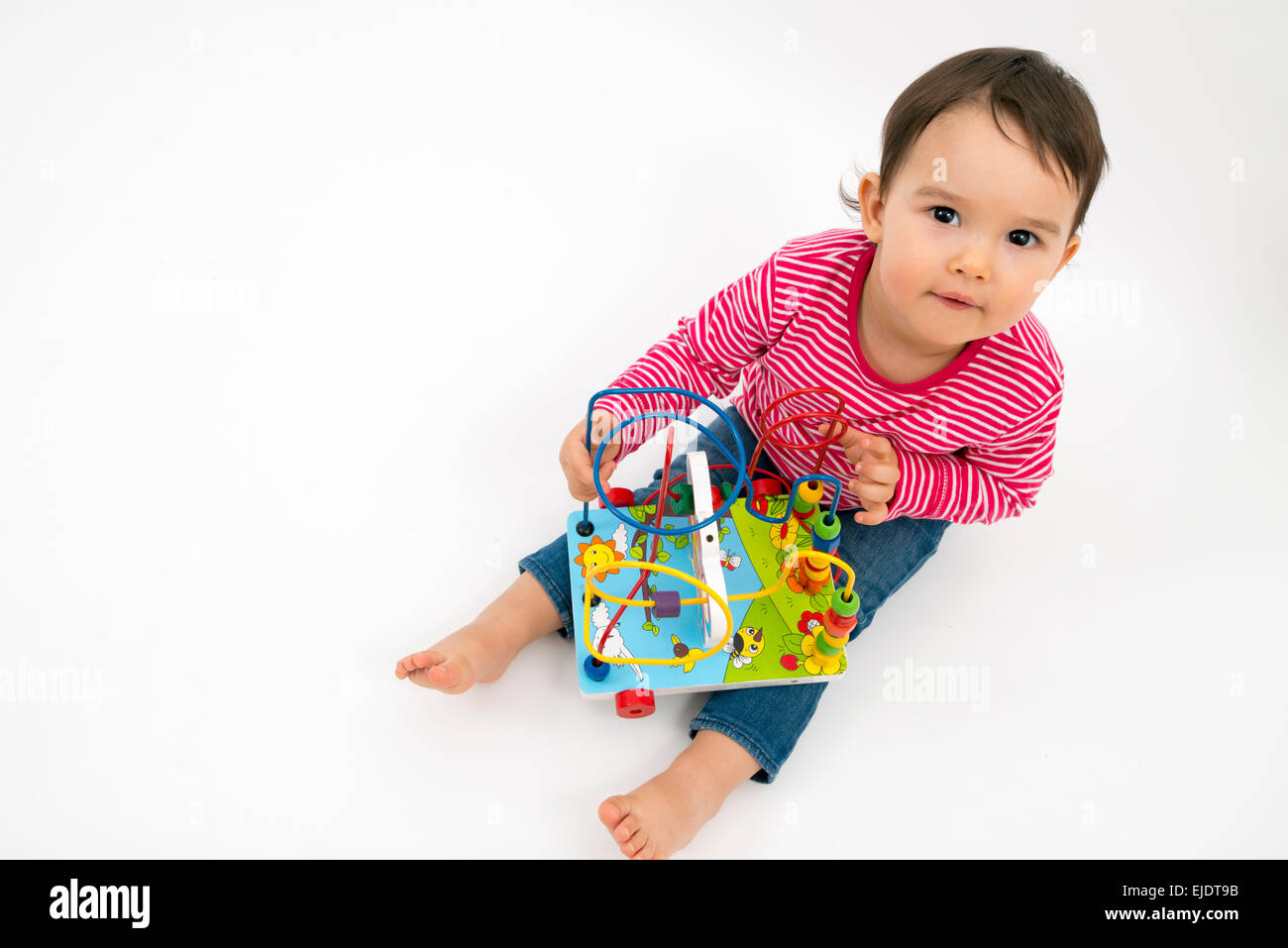 little girl happy with colorful wooden Toy isolated on white background