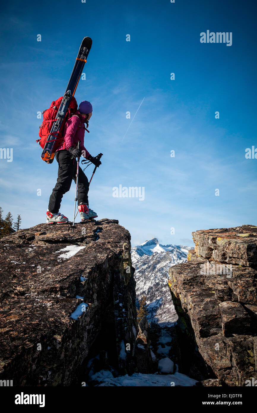 https://c8.alamy.com/comp/EJDTF8/a-woman-backcountry-skier-hikes-a-snow-free-ridge-to-access-high-elevation-EJDTF8.jpg