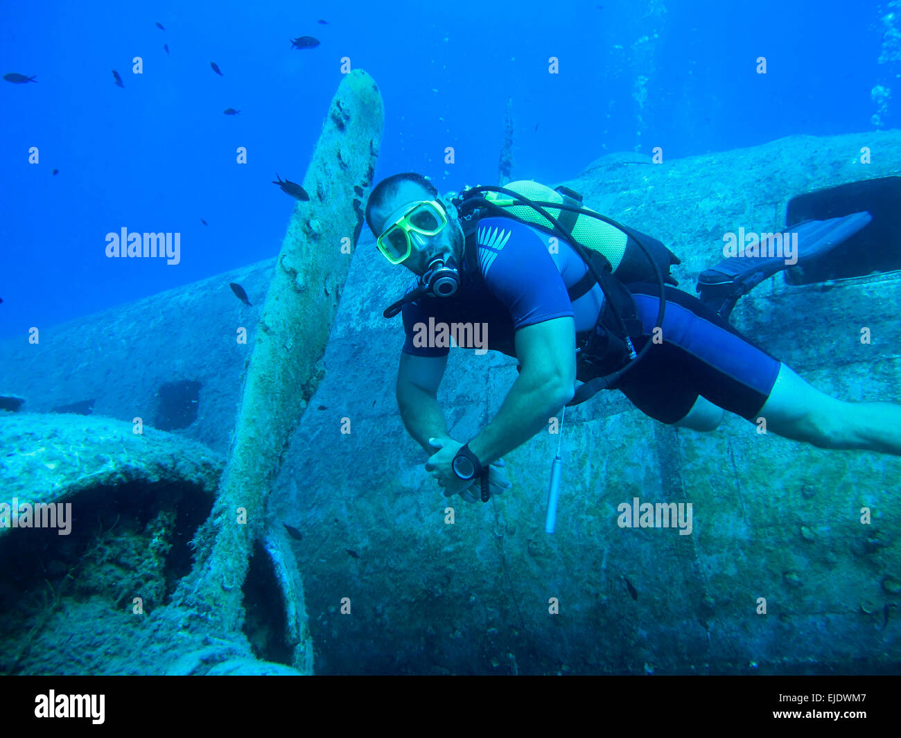 Diver discovering plane wreck Stock Photo
