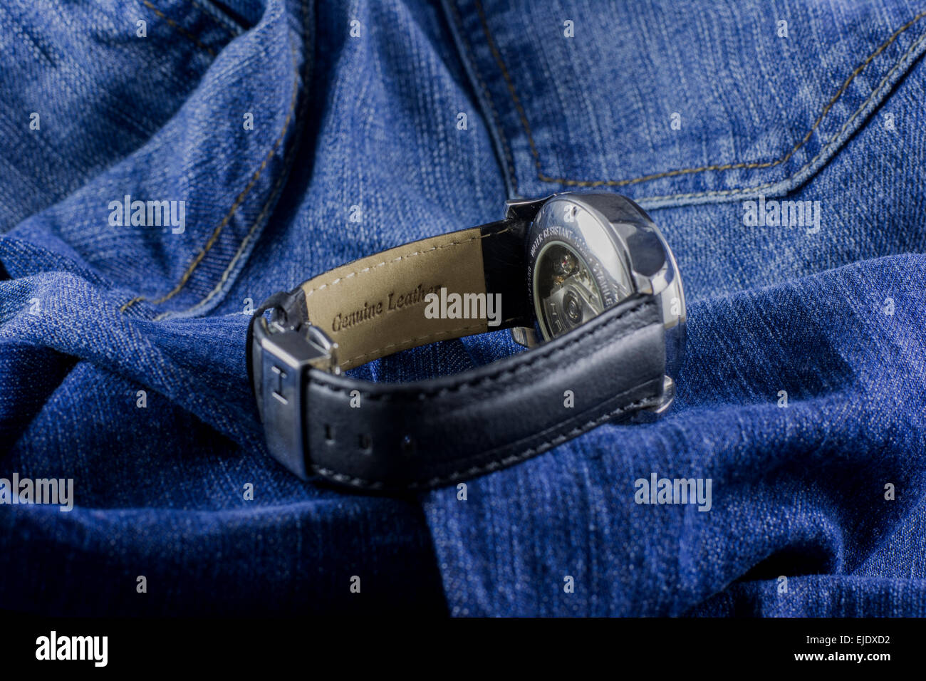 Photo shooting of elegant and luxury male wristwatches on denim background: Hamilton Jazz master wristwatch Stock Photo