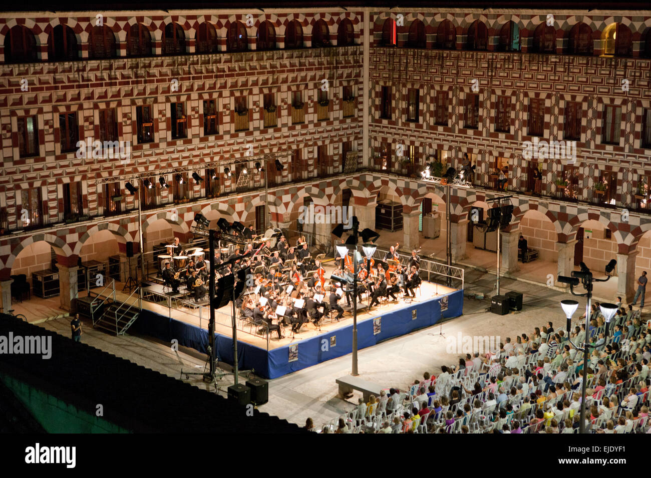 The Extremadura Region Classical Music Orchestra performs at the Hight Square of Badajoz, Spain. Aerial view from the citadel to Stock Photo