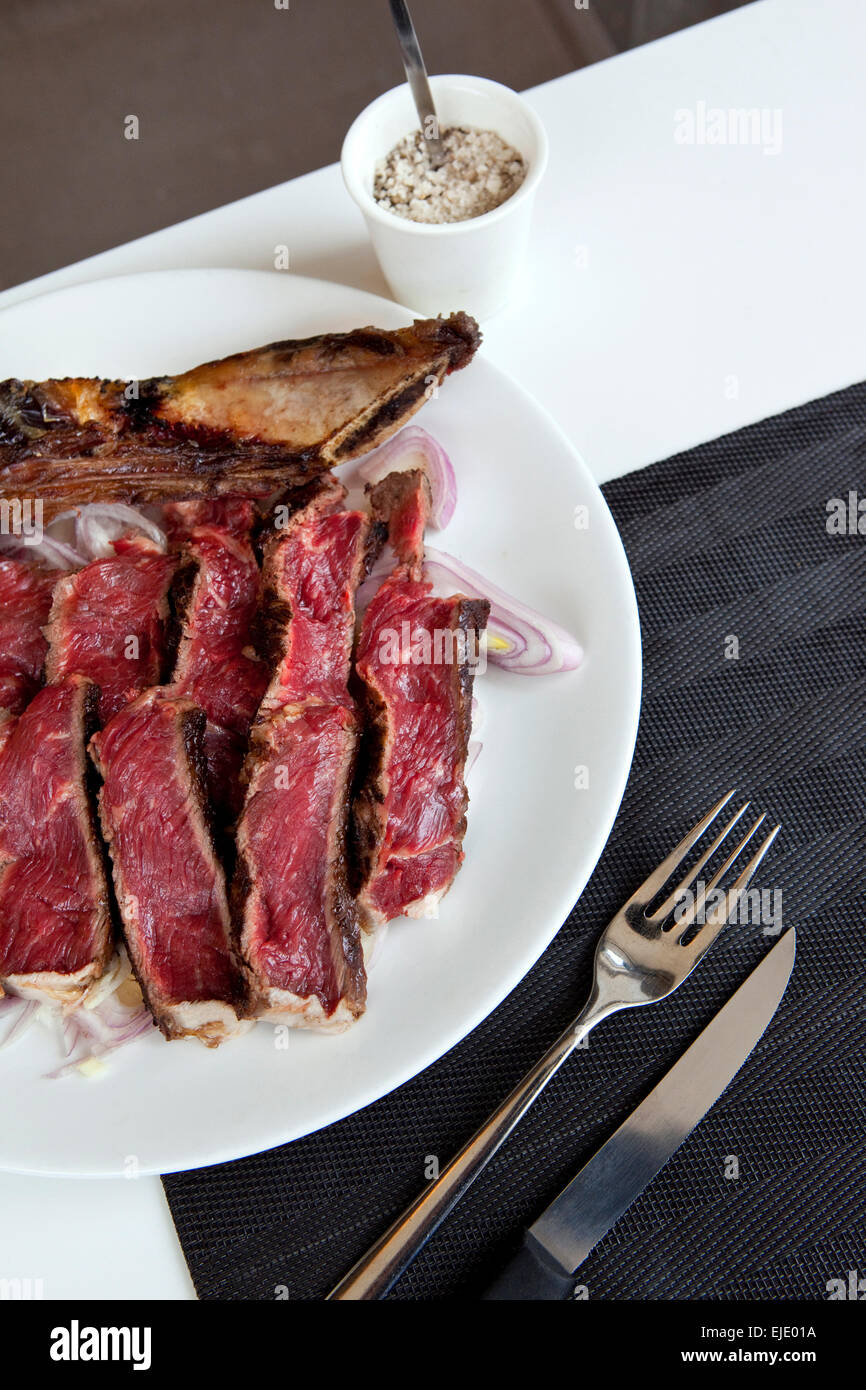 Prime rib and shallots on a plate Stock Photo