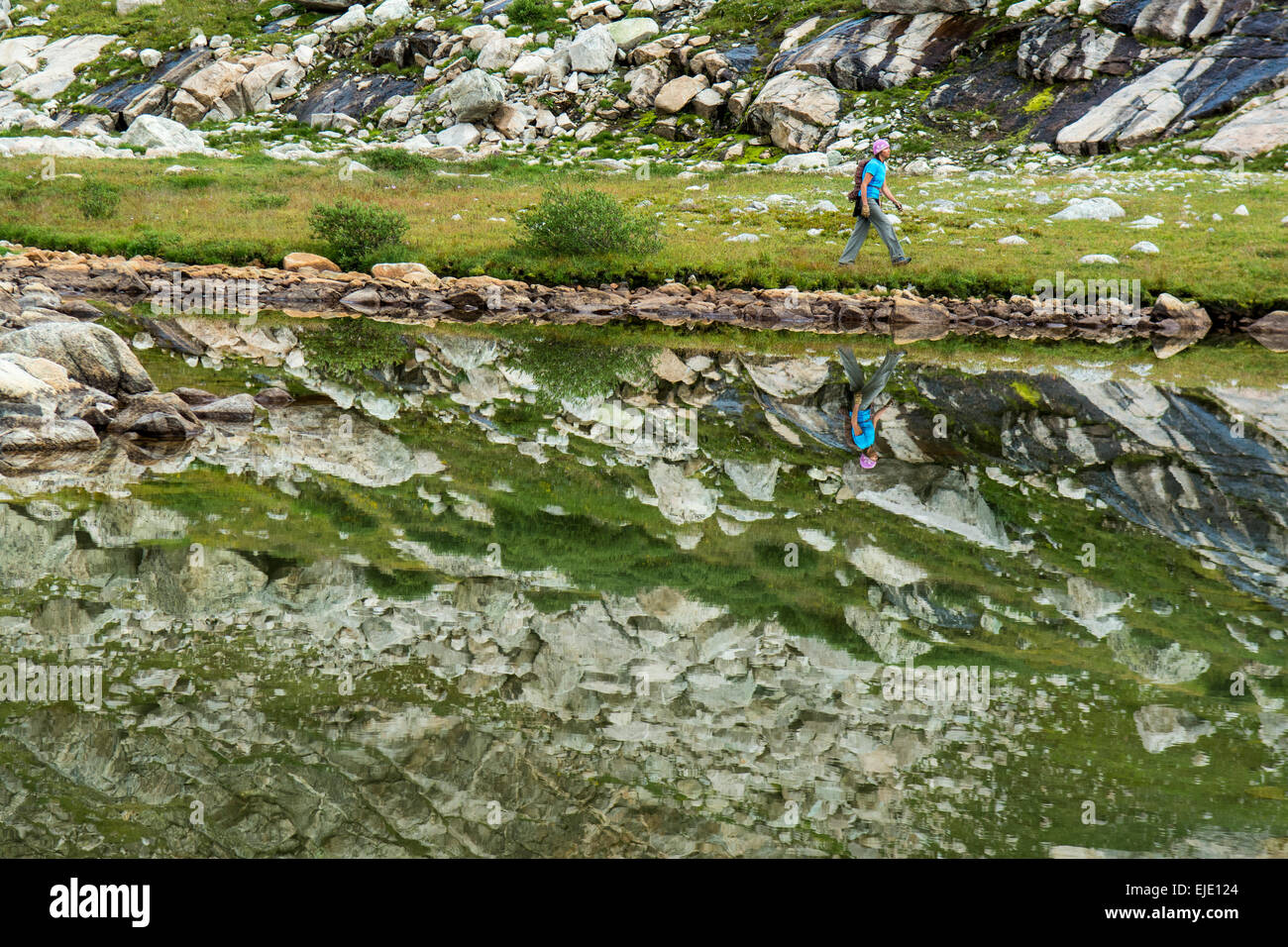 Woman hiker in Titcomb Basin, Wind River Range, Pinedale, Wyoming. Stock Photo