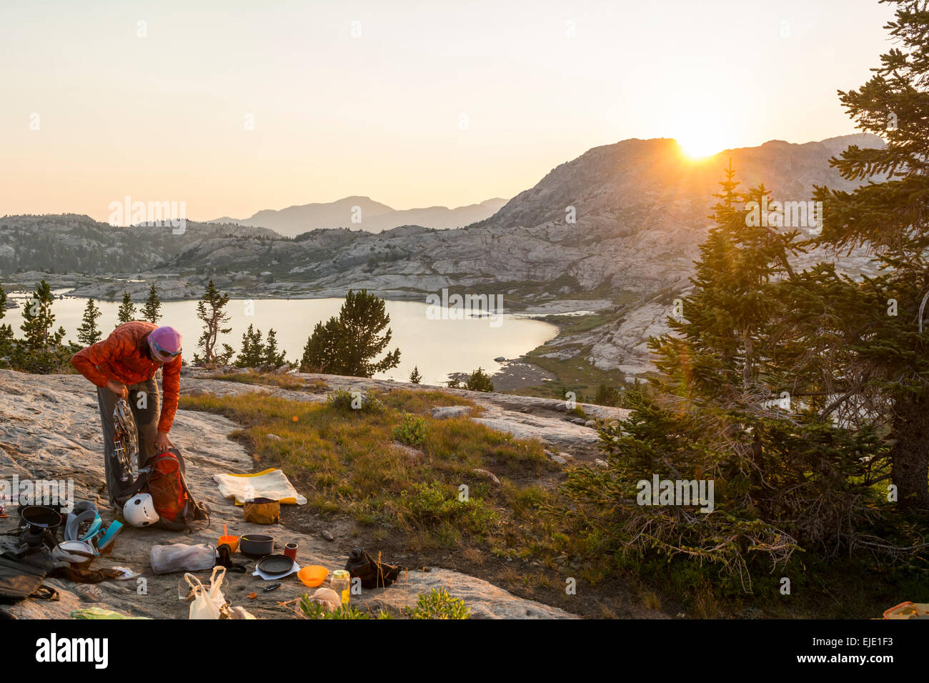 A woman packing camp in Titcomb Basin, Wind River Range, Pinedale, Wyoming. Stock Photo