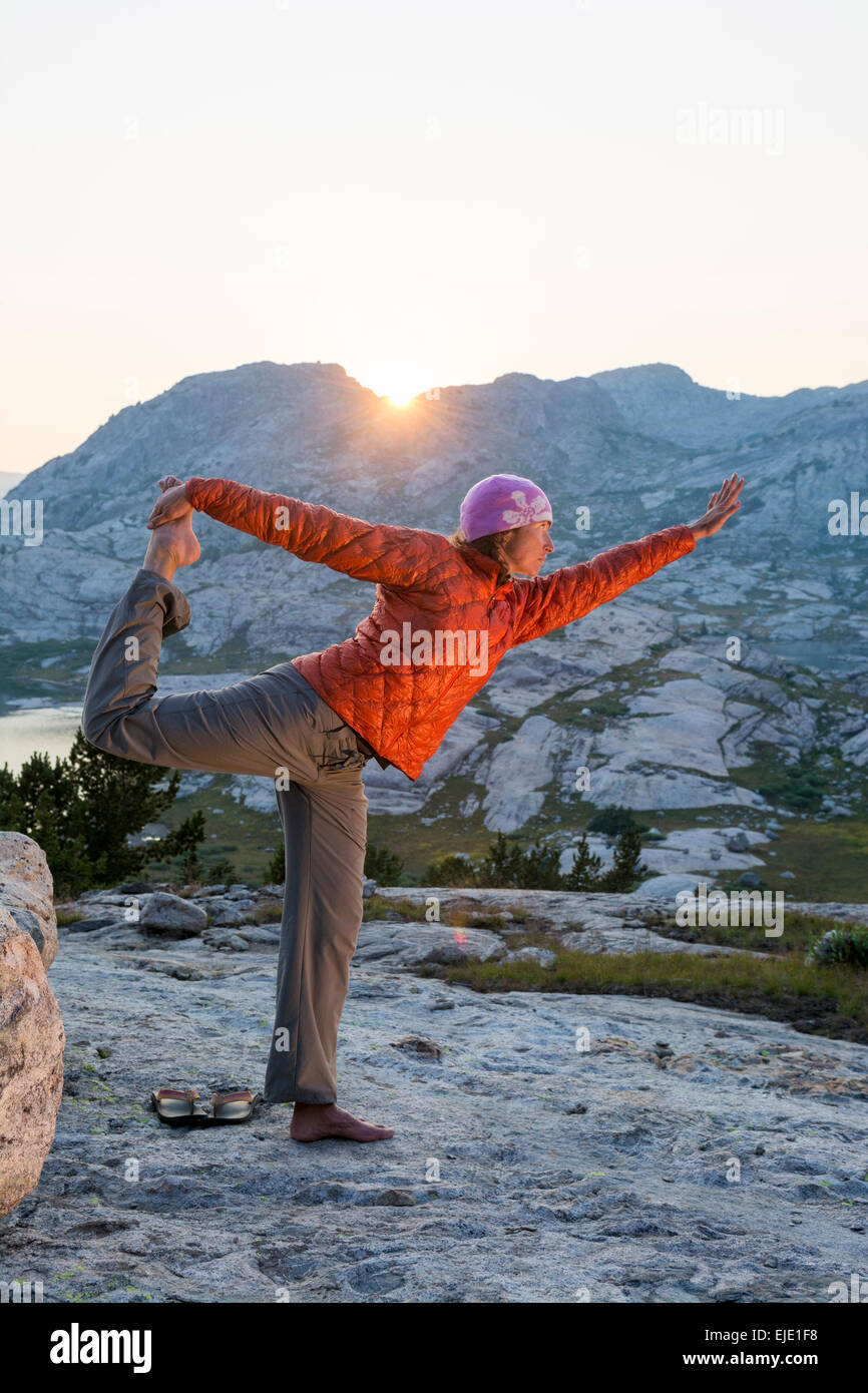 Sunset yoga in Titcomb Basin, WInd River Range, Pinedale, Wyoming. Stock Photo