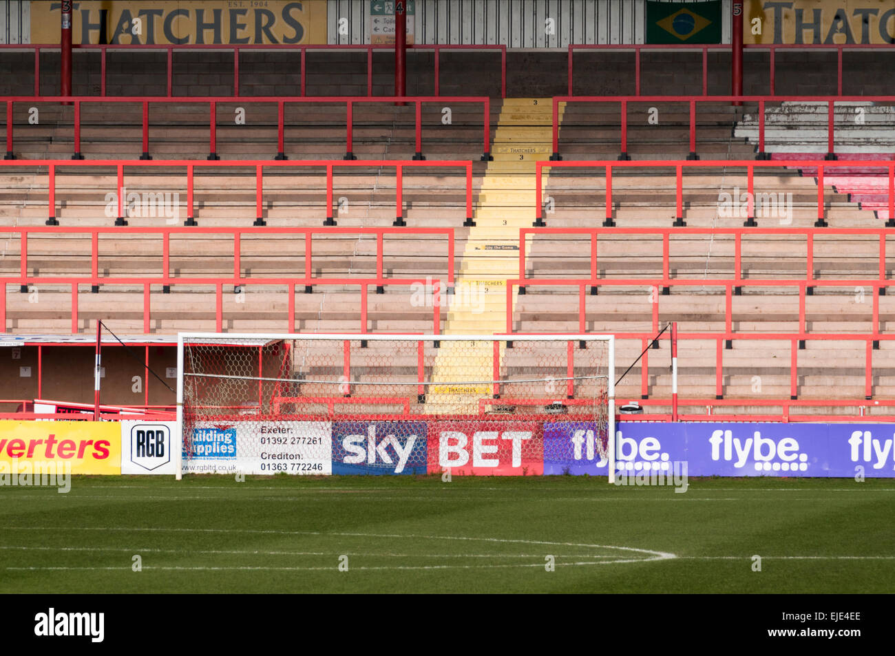 Looking Across The Pitch Towards The Goal And Empty Terraces Of Exeter City Football Ground At St James Park Stock Photo Alamy