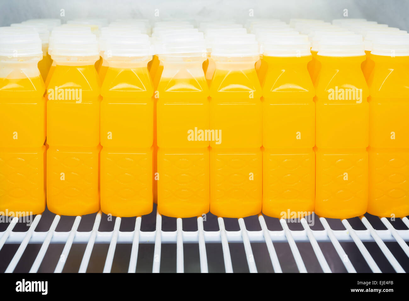 https://c8.alamy.com/comp/EJE4FB/orange-juice-bottles-in-refrigerator-EJE4FB.jpg