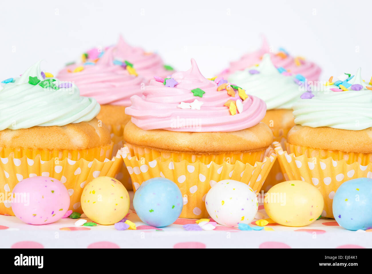 Pastel Easter cupcakes with candy and sprinkles Stock Photo Alamy