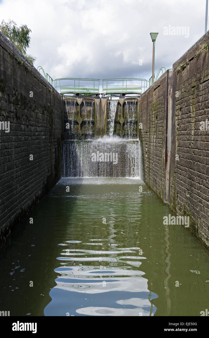 Entering a lock from the downstream side on the Canal du Centre, France. Stock Photo