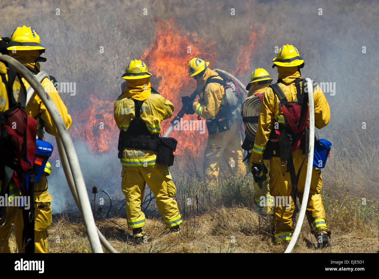Firefighter Fighting Fire Stock Photo