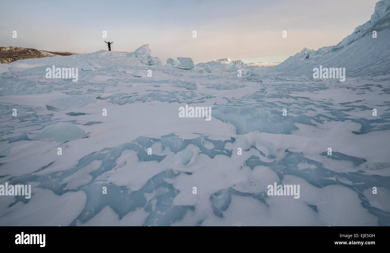 Standing on an iceberg in the Ross Sea, Antarctica. Stock Photo