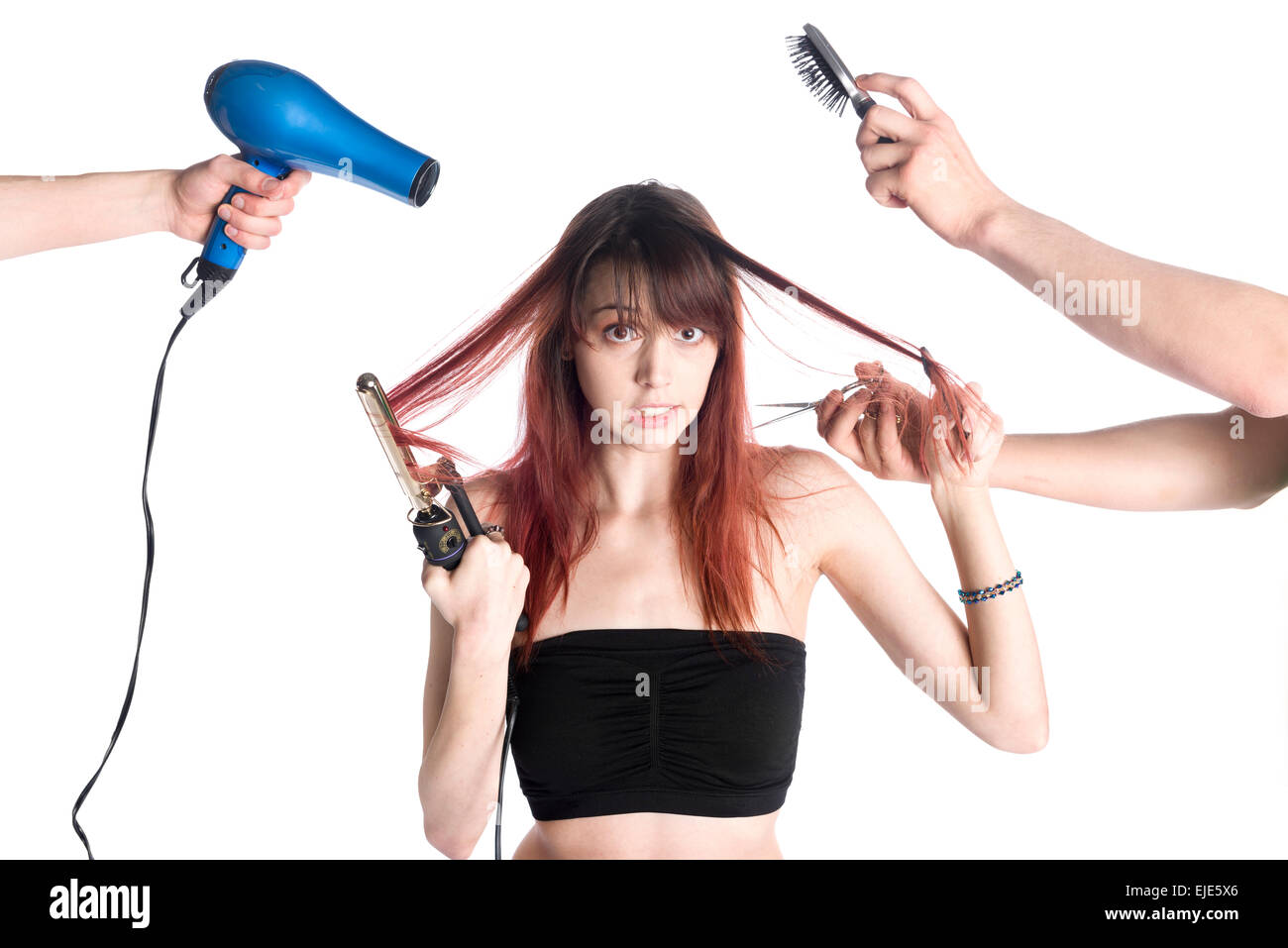 Unhappy Young Woman with Two Hairstylists Stock Photo