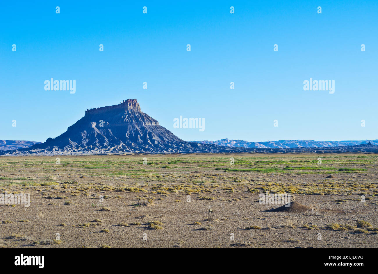Factory Butte, a massive butte rising above the desert in Utah, near Hanksville, in the United States. Stock Photo