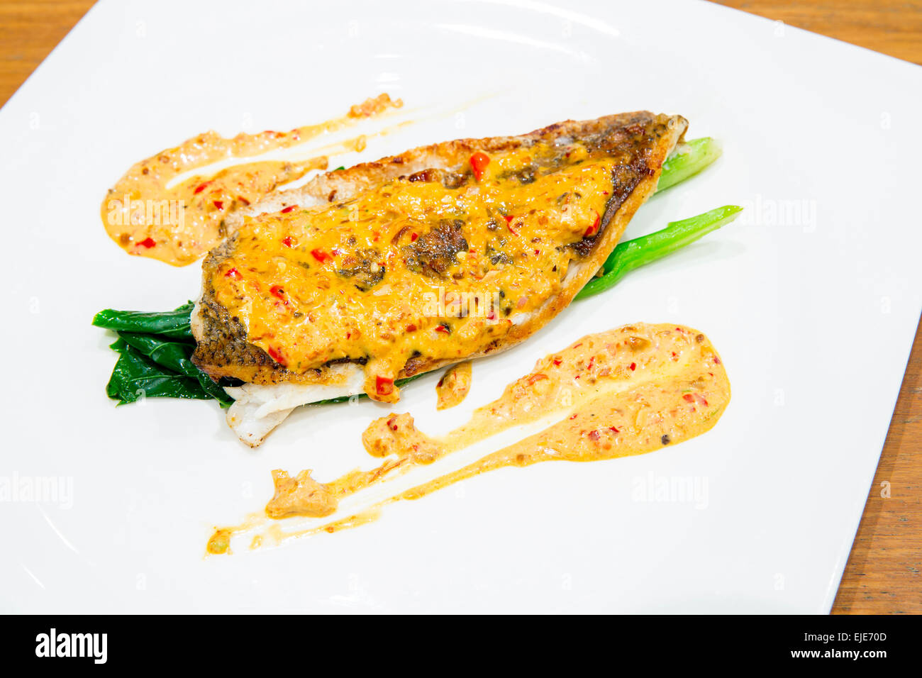 grilled barramundi steak with spicy sauce Stock Photo Alamy