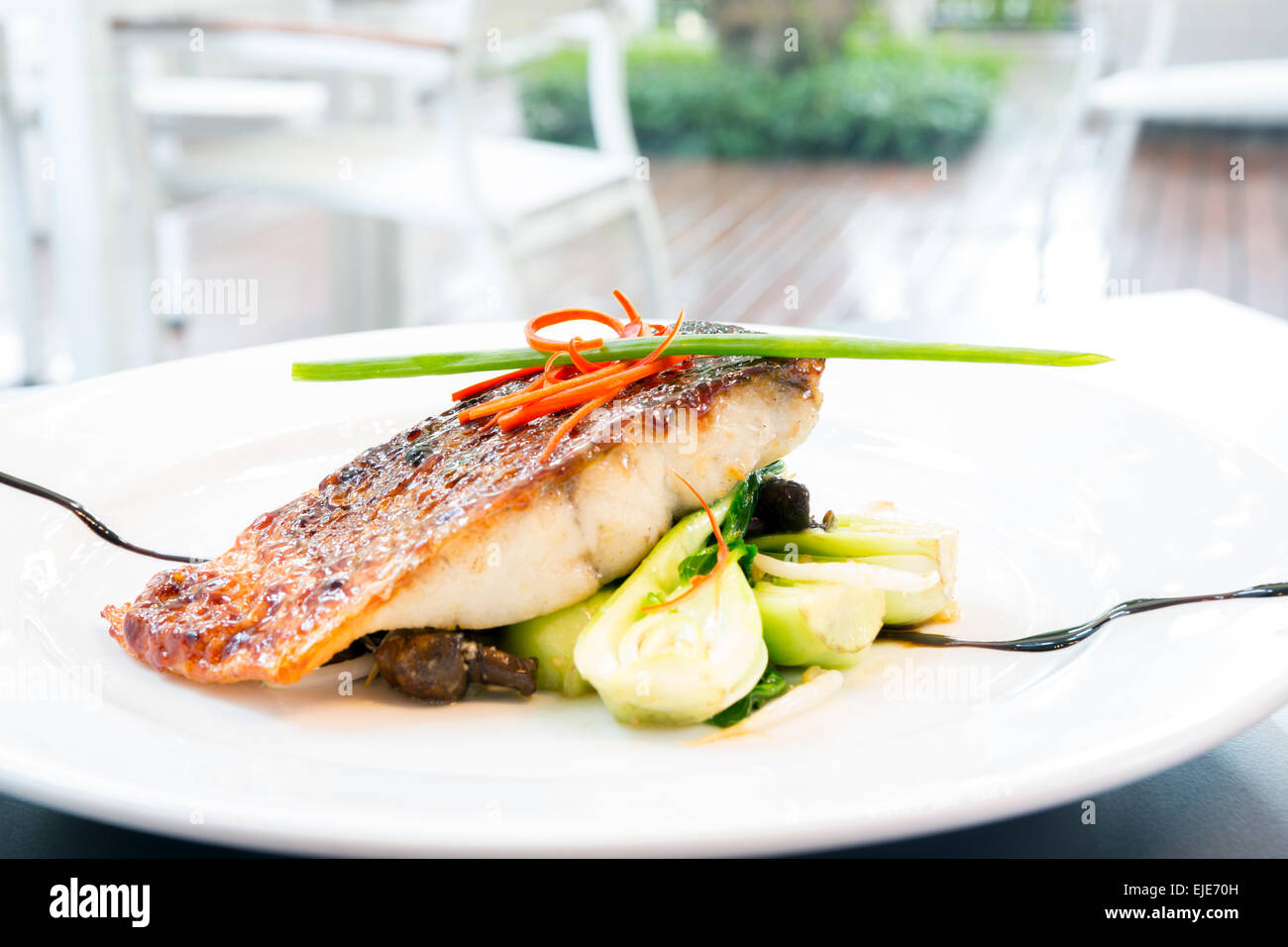 grilled barramundi steak with sweet sauce Stock Photo Alamy
