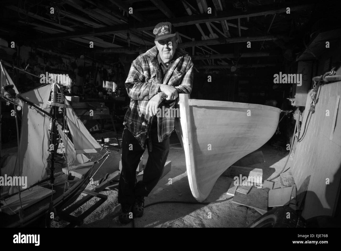 Patsy Christie of Englishtown, Nova Scotia constructs what will be his last wooden boat. Stock Photo