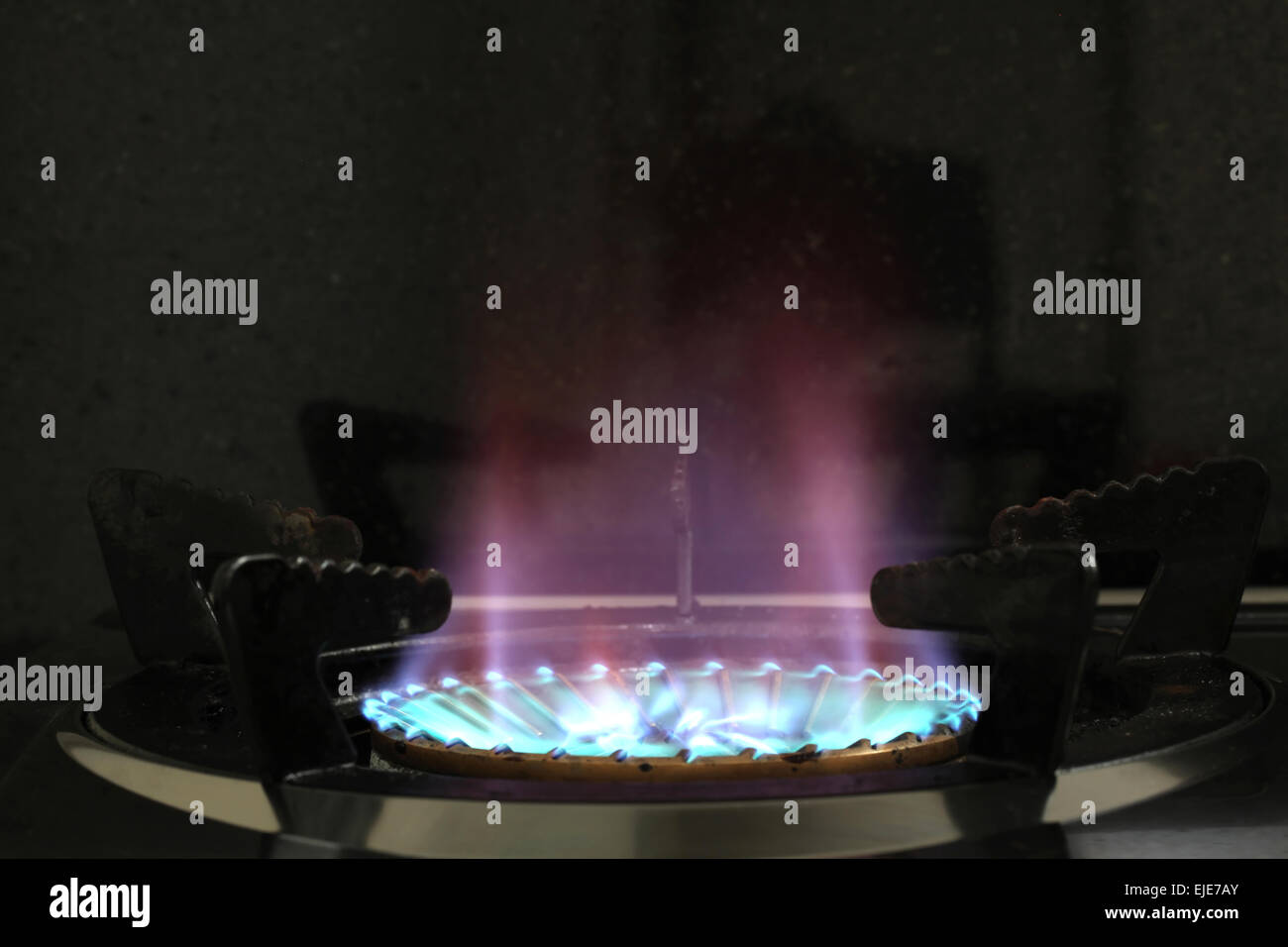 LPG Gas Burner Oven Hob  from a Stove in Kitchen on Black Background Stock Photo