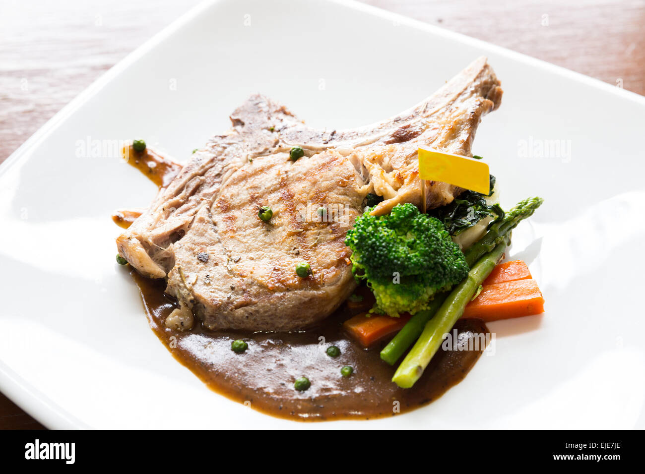 Gourmet Main Entree Course grilled pork chop Stock Photo Alamy