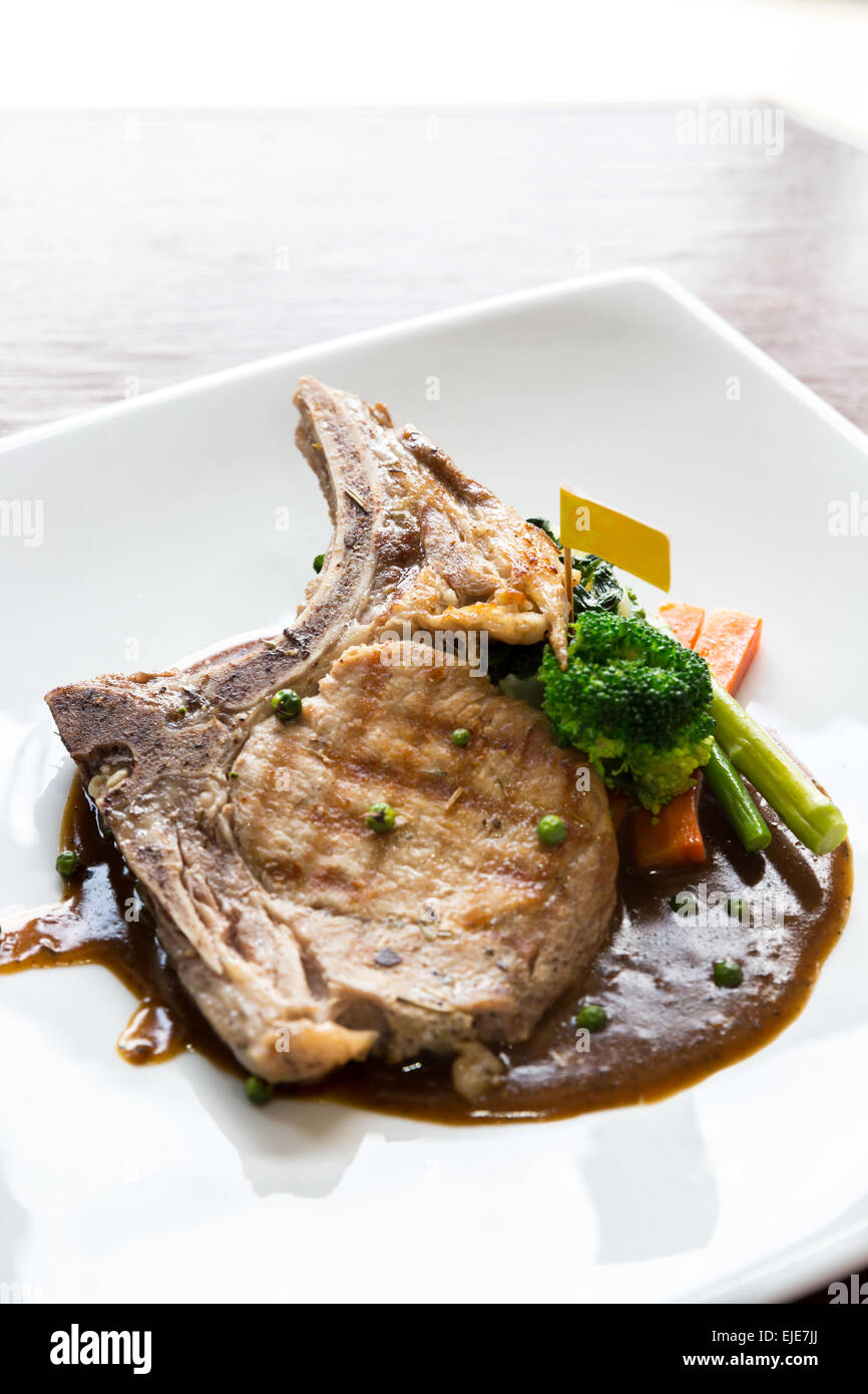 Gourmet Main Entree Course grilled pork chop Stock Photo Alamy