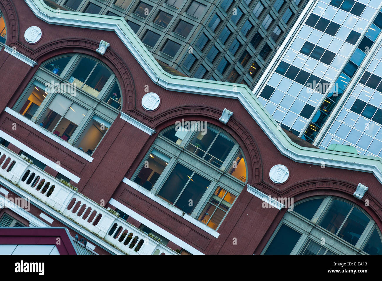 Contrasting building styles between the Waterfront Station and newer glass towers in Vancouver Stock Photo