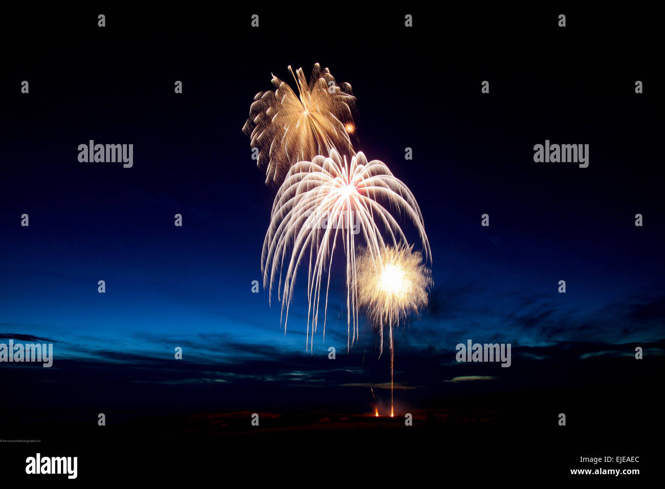 fireworks display at dusk Stock Photo