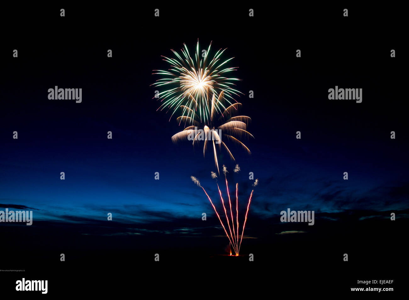 fireworks display at dusk Stock Photo