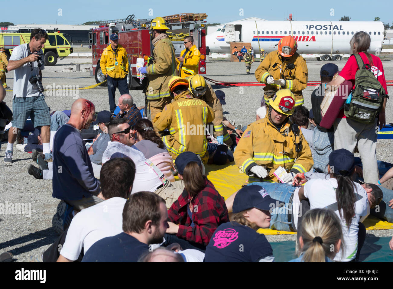 Burbank, California, USA. 24th March, 2015.  Firefighters perform triage during the Triennial Full Scale Emergency Exercise  at Bob Hope  Airport Credit:  Chester Brown/Alamy Live News Stock Photo