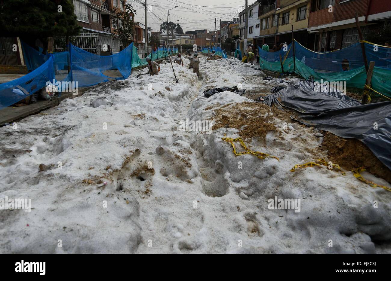 Bogota, Colombia. 24th Mar, 2015. Municipal employees clean a street in ...