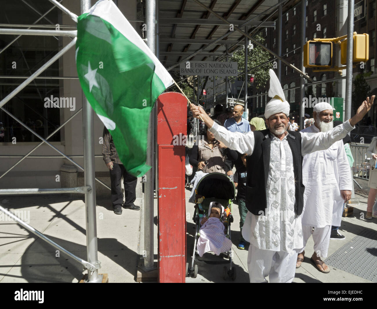 Participant in Muslim American Day Parade in New York City waves Pakistani flag, 2014. Stock Photo