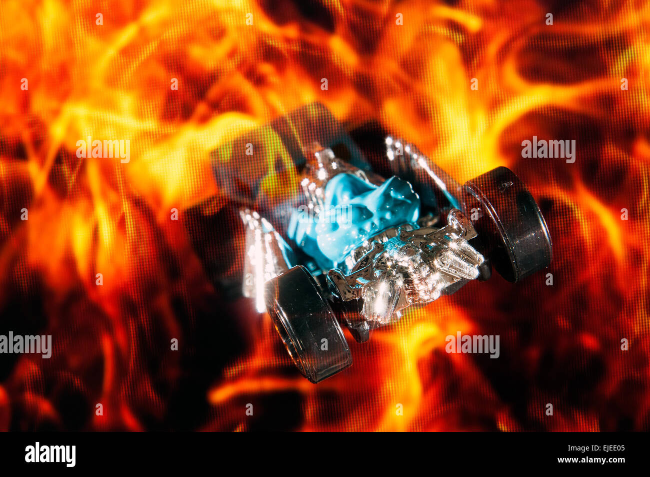 Generic hot rod car in fire in studio setting Stock Photo