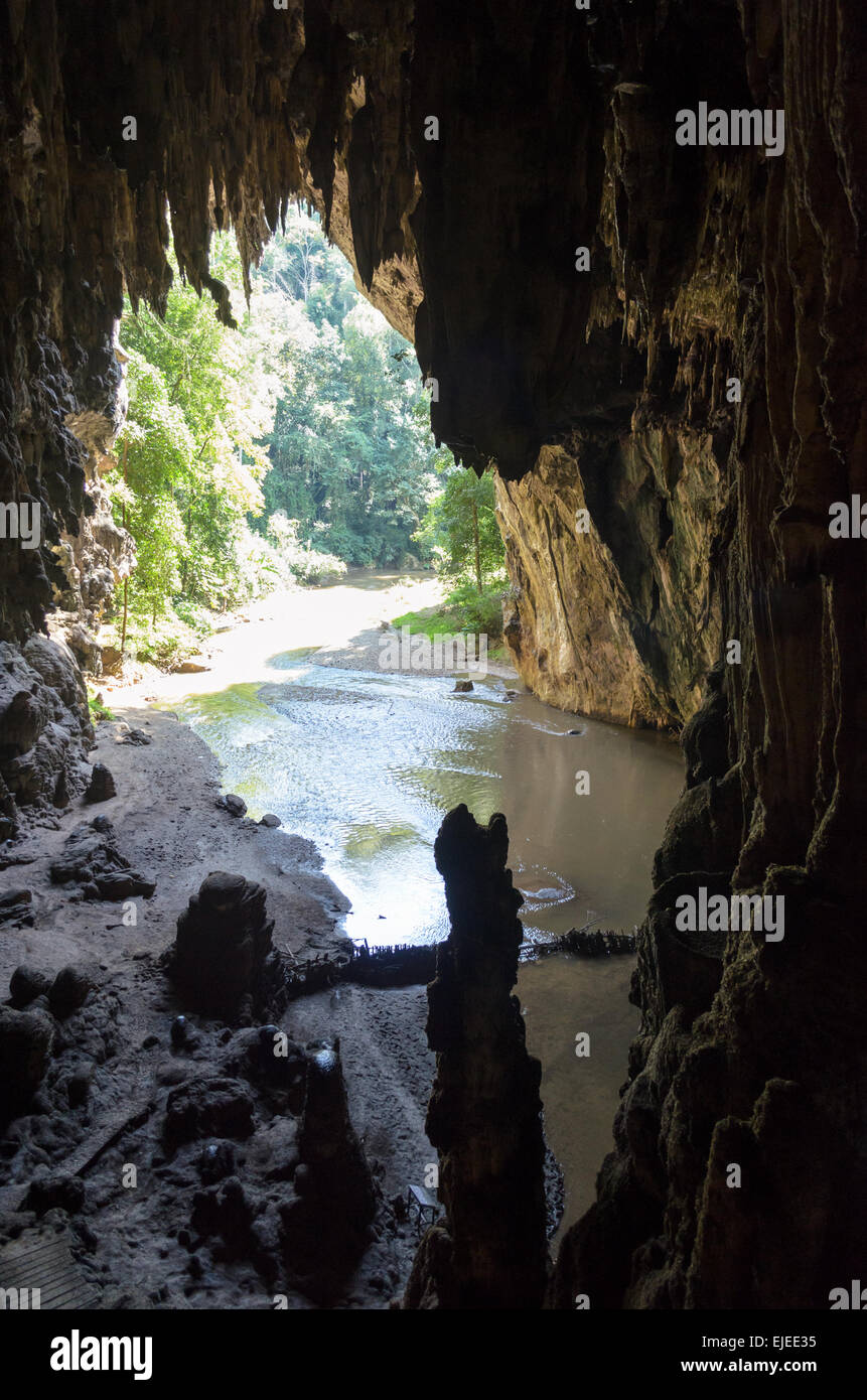 One side of entrance to a cave with stalagmite and stalactite at Tham Lod National Park, Mae Hong Son Province, Thailand Stock Photo