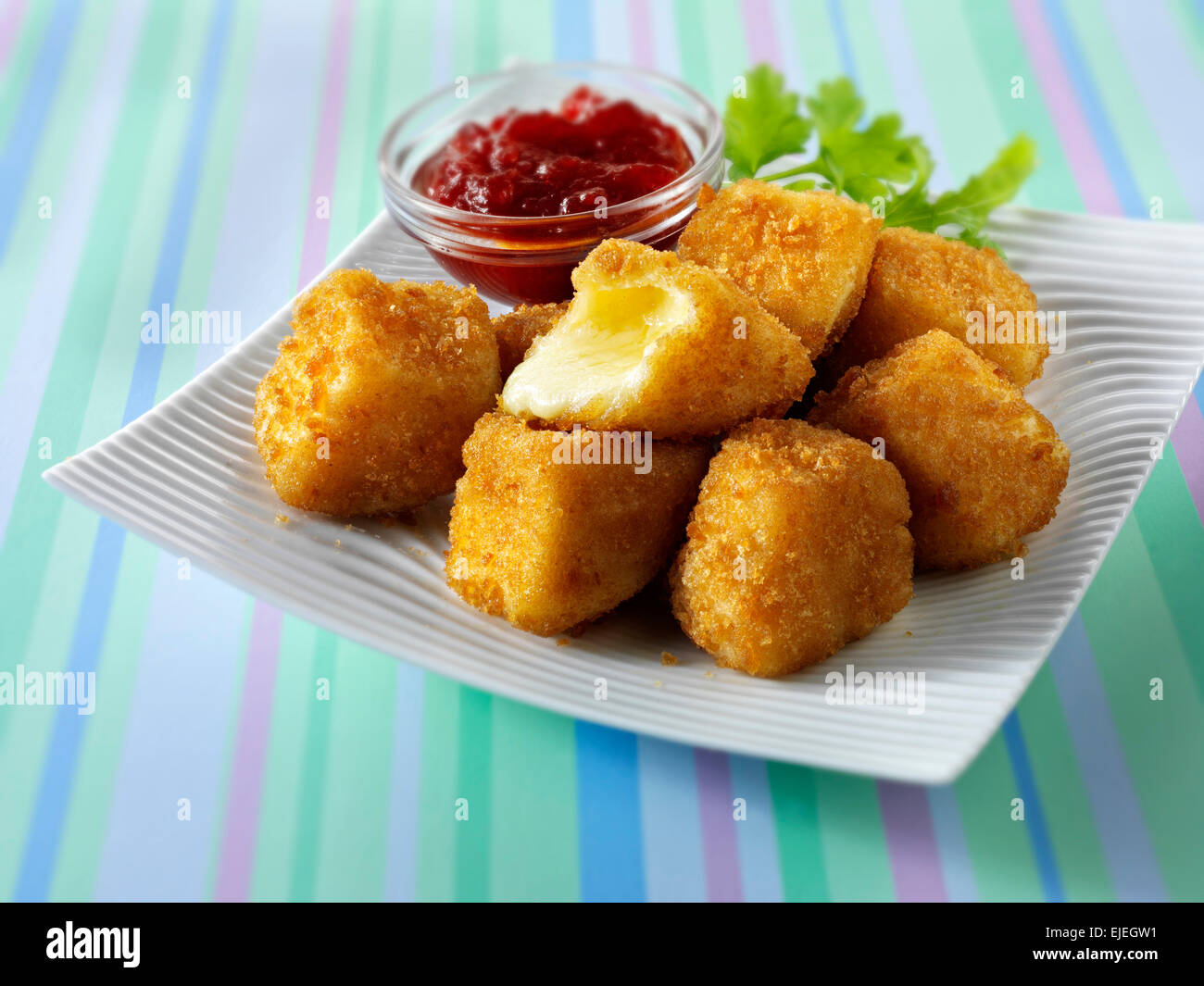 Deep fried camembert cheese in bread crumbs with salad Stock Photo