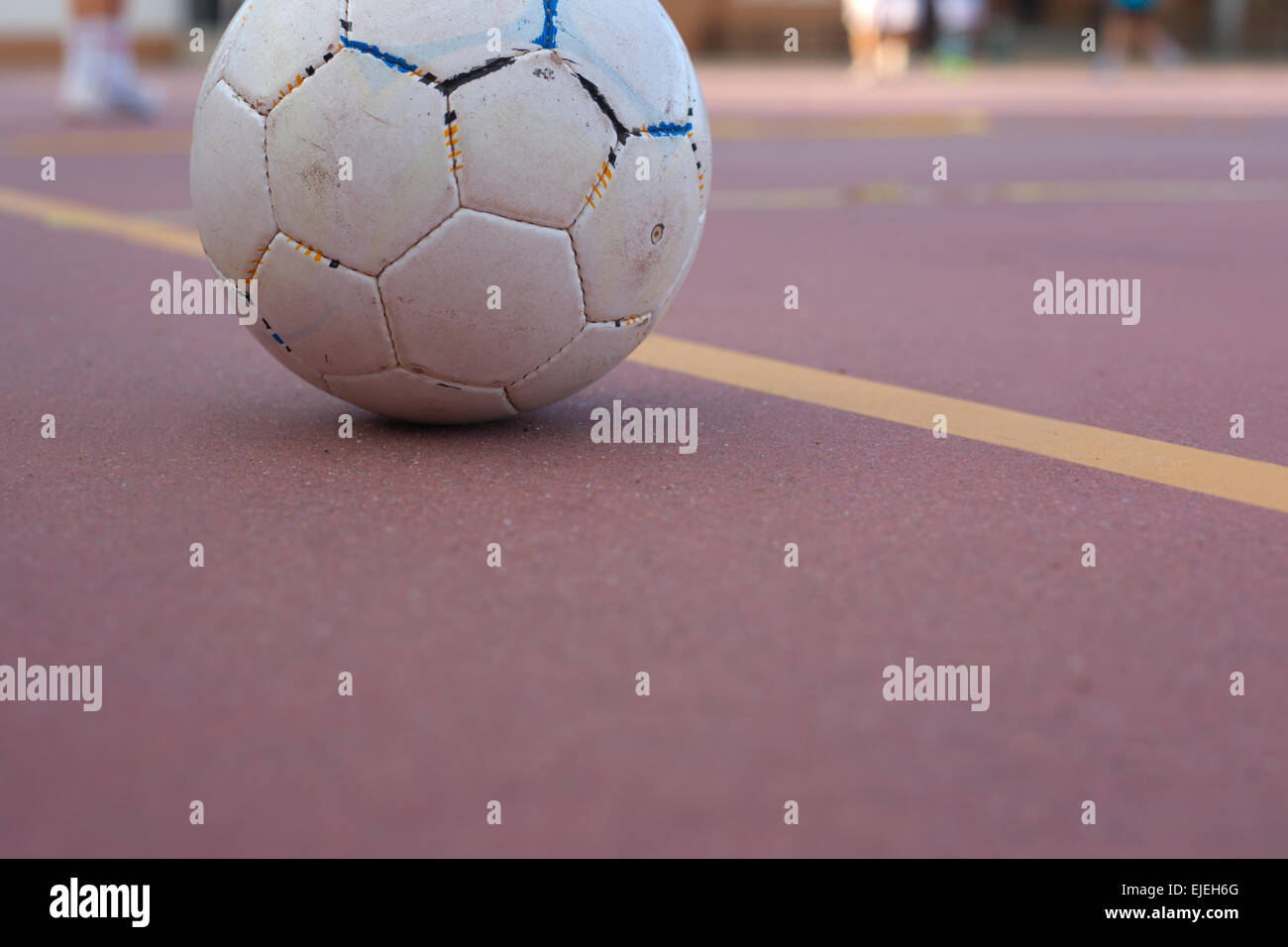 5 a side football team training over outdoors red court Stock Photo