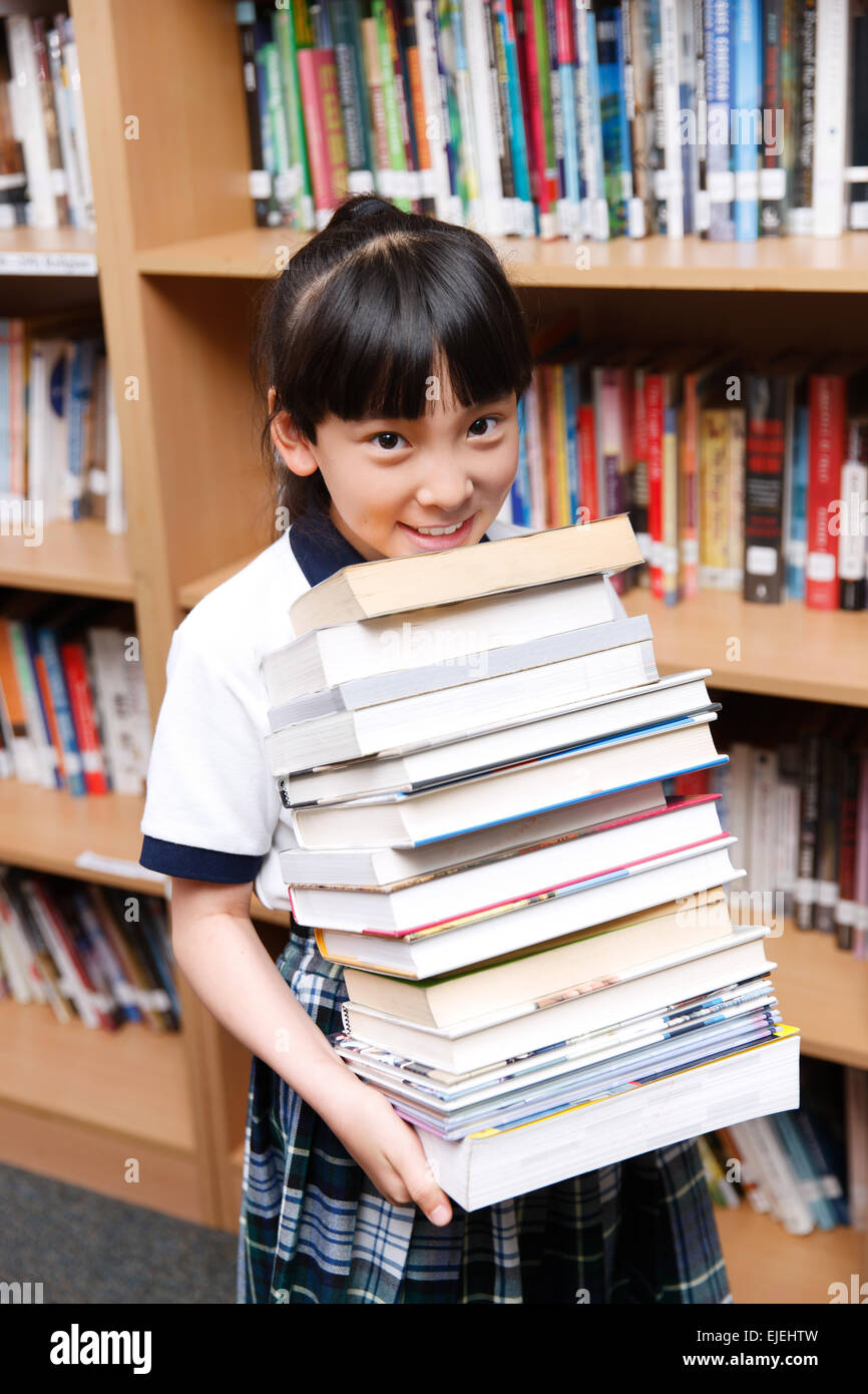 Indian school girls reading book hi-res stock photography and images ...