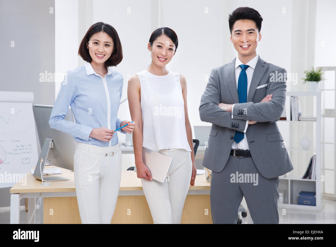 The young business people standing in the Office Stock Photo - Alamy