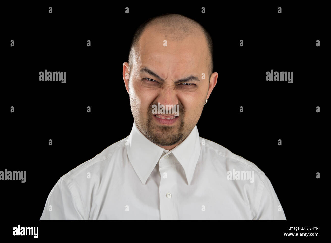 mean looking man isolated on black background Stock Photo