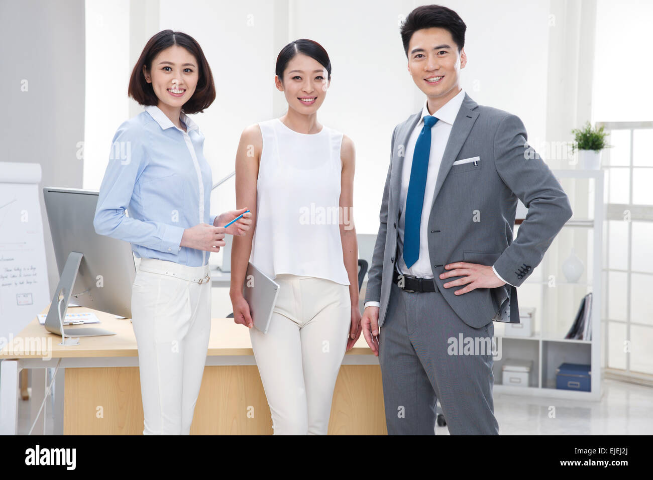 The young business people standing in the Office Stock Photo - Alamy