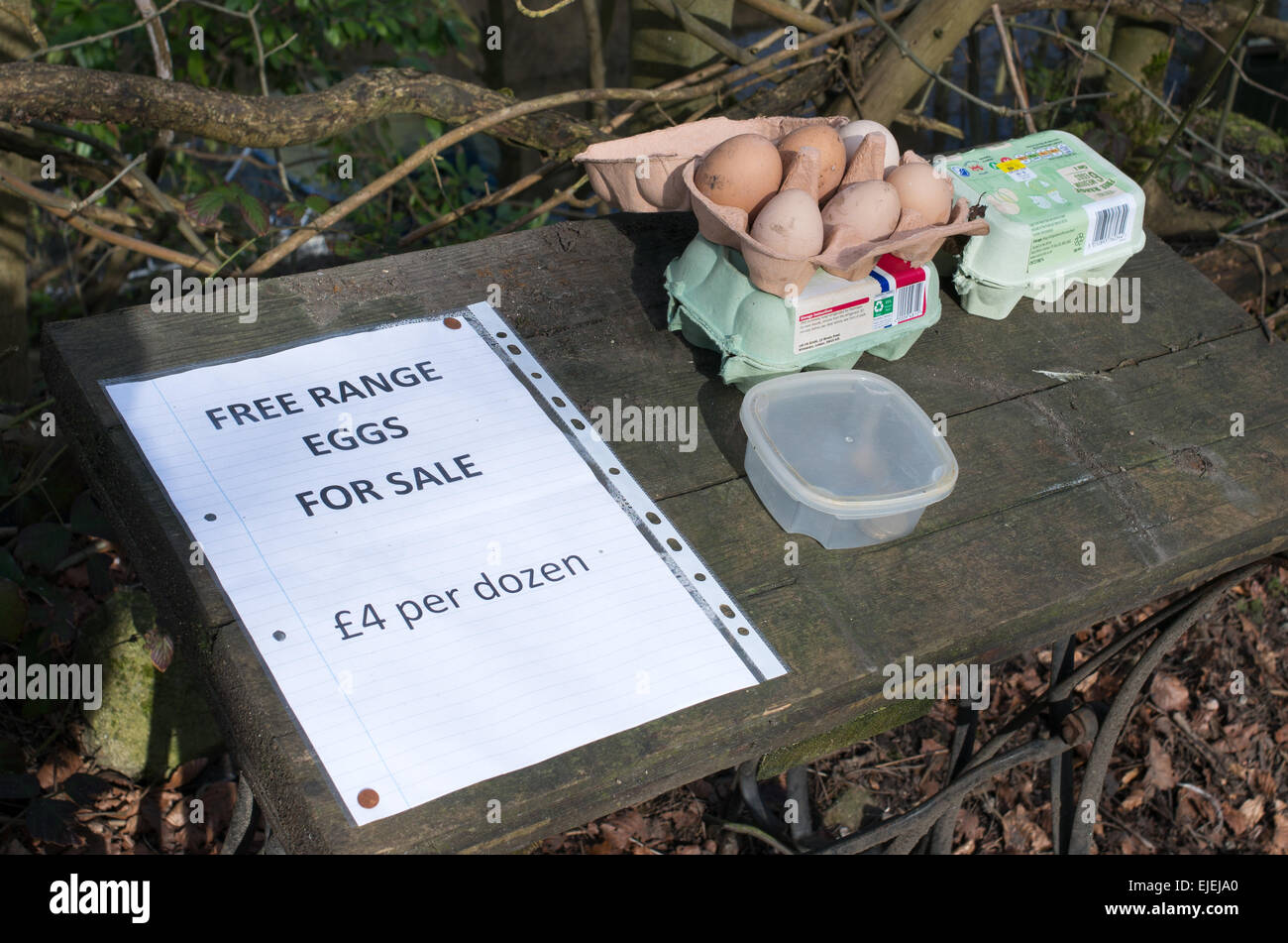 Free range eggs for sale at the roadside in Hebden Bridge, West Yorkshire, England, UK Stock Photo