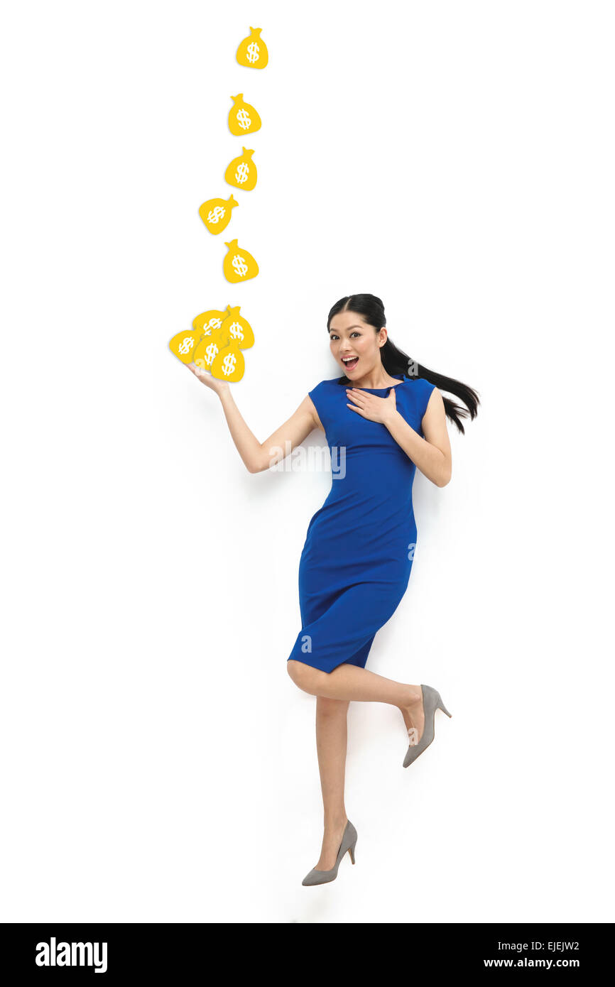 Money falling out of purse hi-res stock photography and images - Alamy