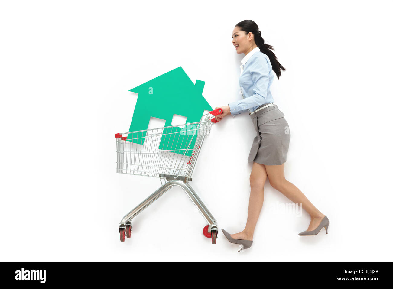 Woman pushing shopping cart side view hires stock photography and images Alamy