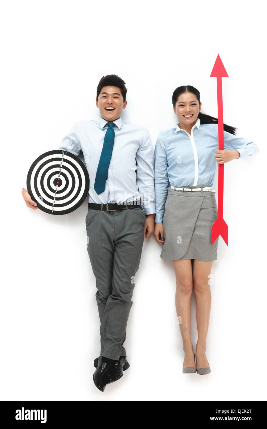 The business of young men and women with a circular target and darts Stock  Photo - Alamy