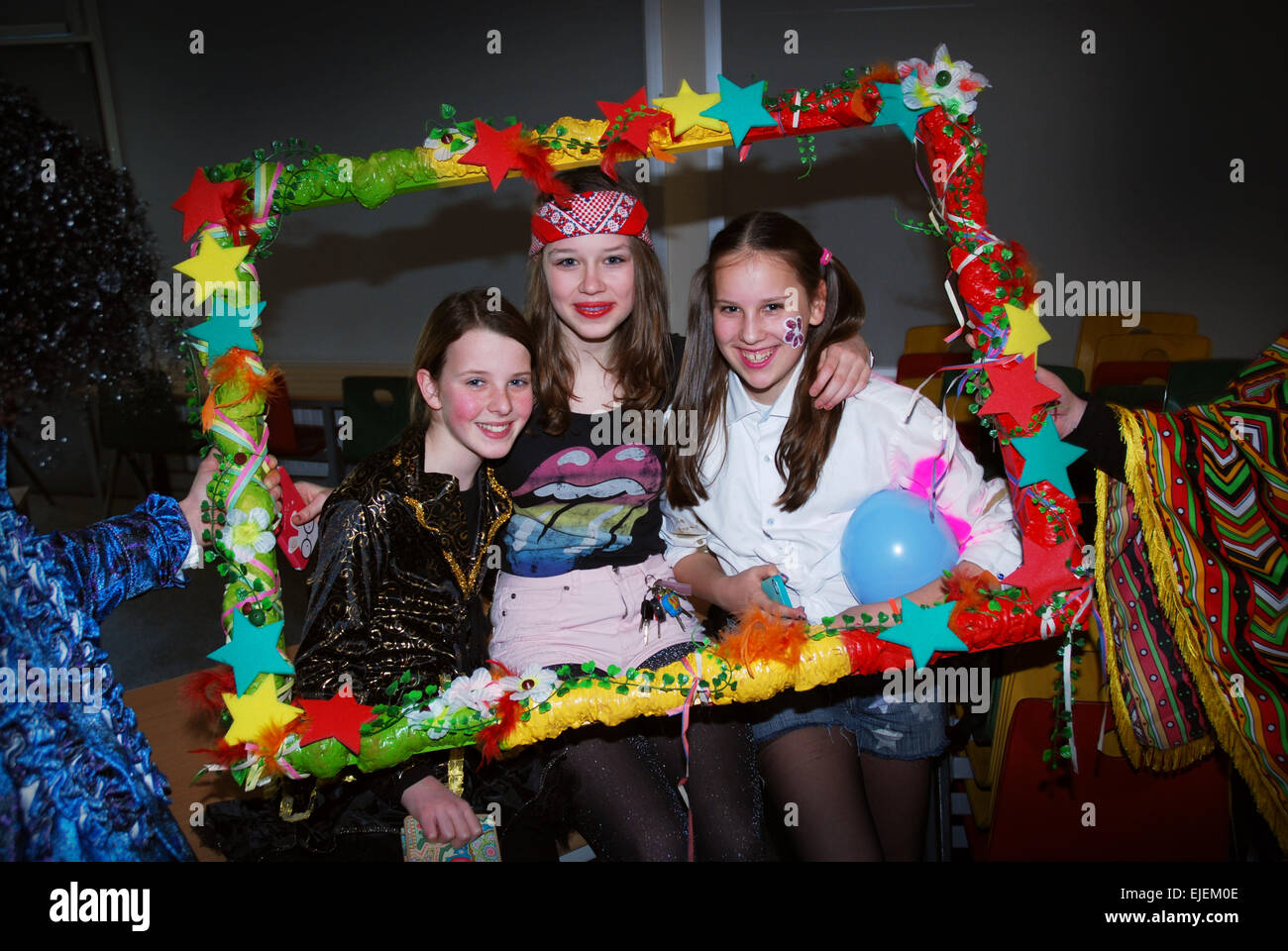 Schoolgirls having fun at carnival, Netherlands Stock Photo