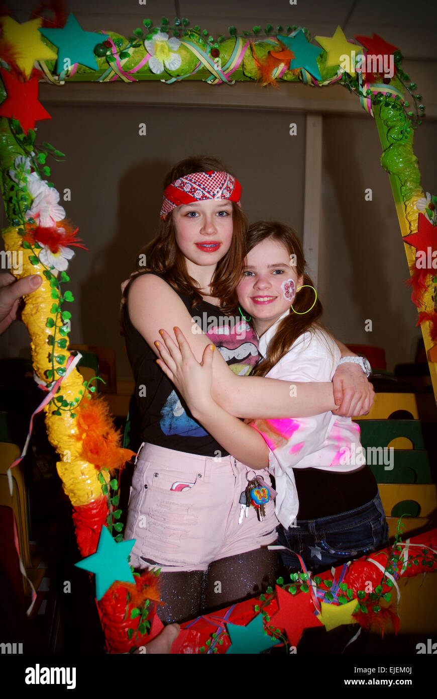 Schoolgirls having fun at carnival, Netherlands Stock Photo