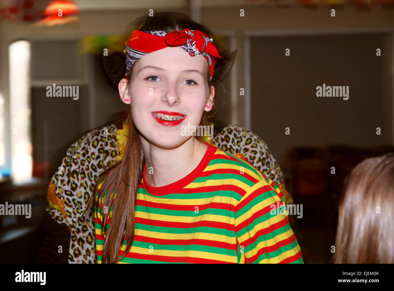 Schoolgirl having fun at carnival, Netherlands Stock Photo