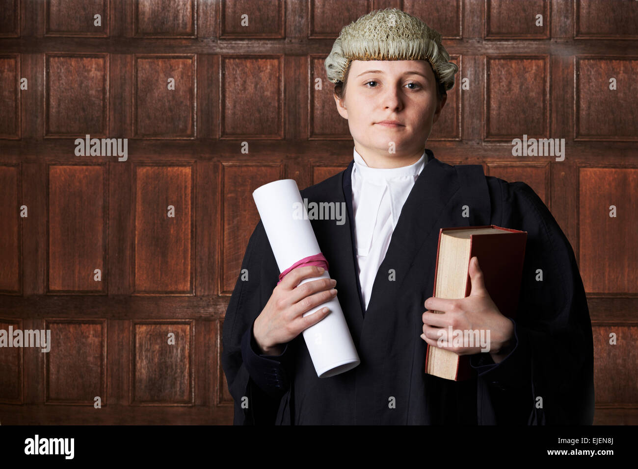 Portrait Of Female Lawyer In Court Holding Brief And Book Stock Photo