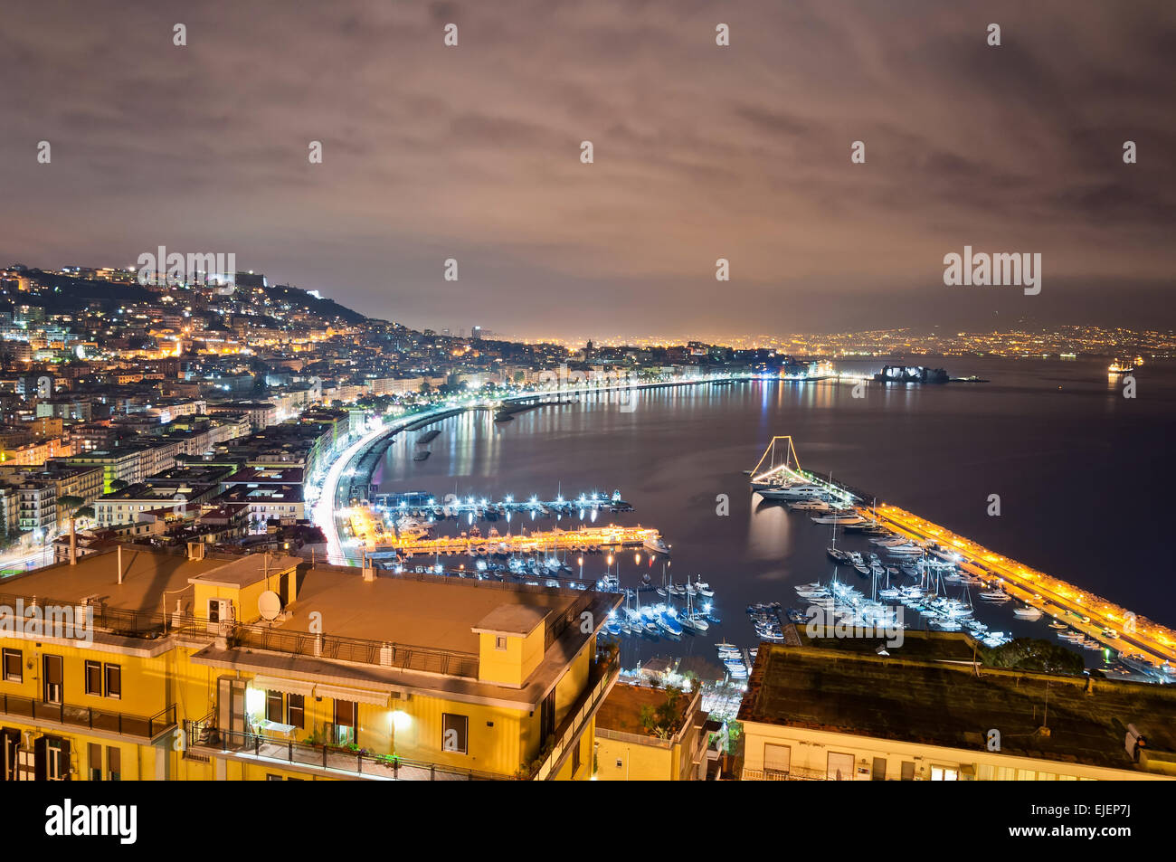 Night view of Naples from Posillipo with Mediterranean sea and Vesuvius mount Stock Photo