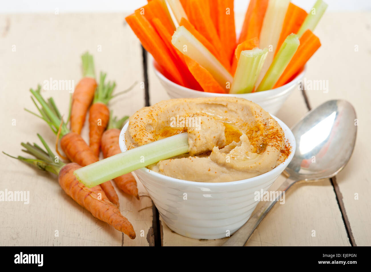 fresh hummus dip with raw carrot and celery arab middle eastent healthy